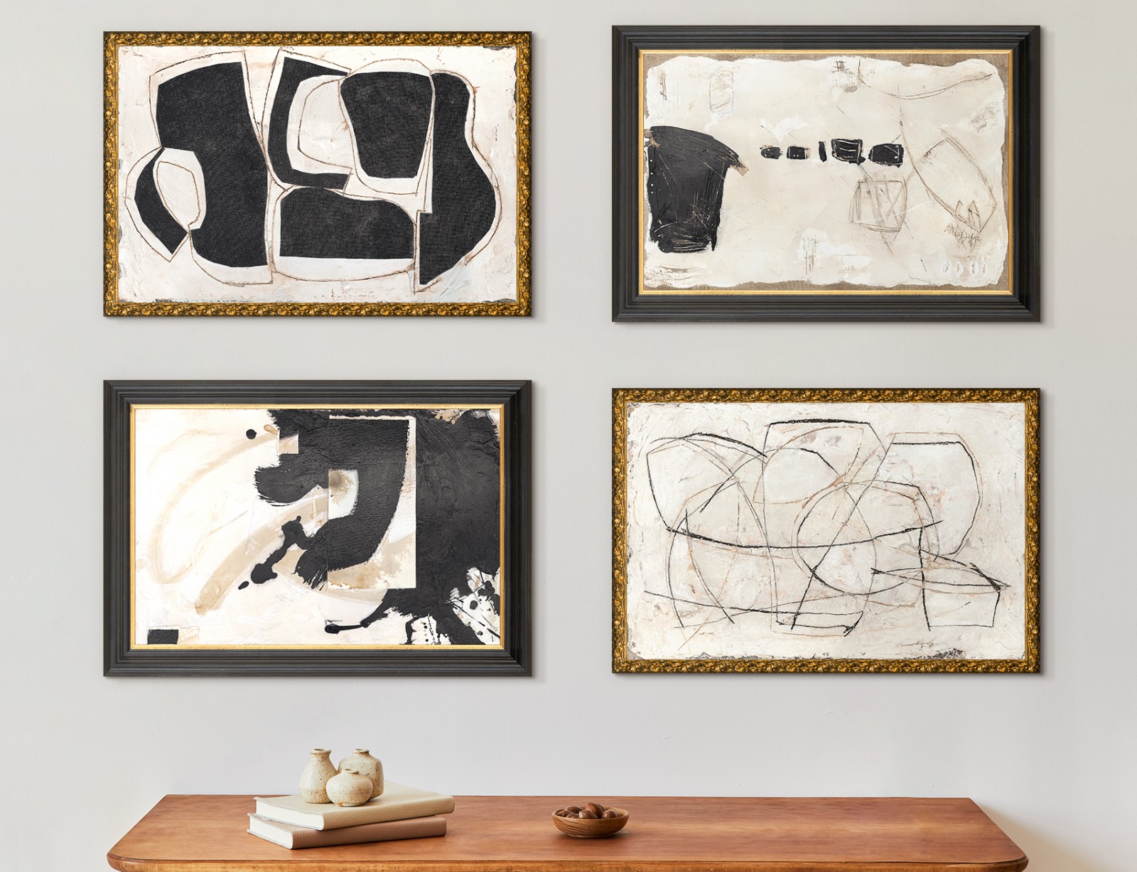 Room interior with brown table against a wall with 6 black and white abstract paintings.